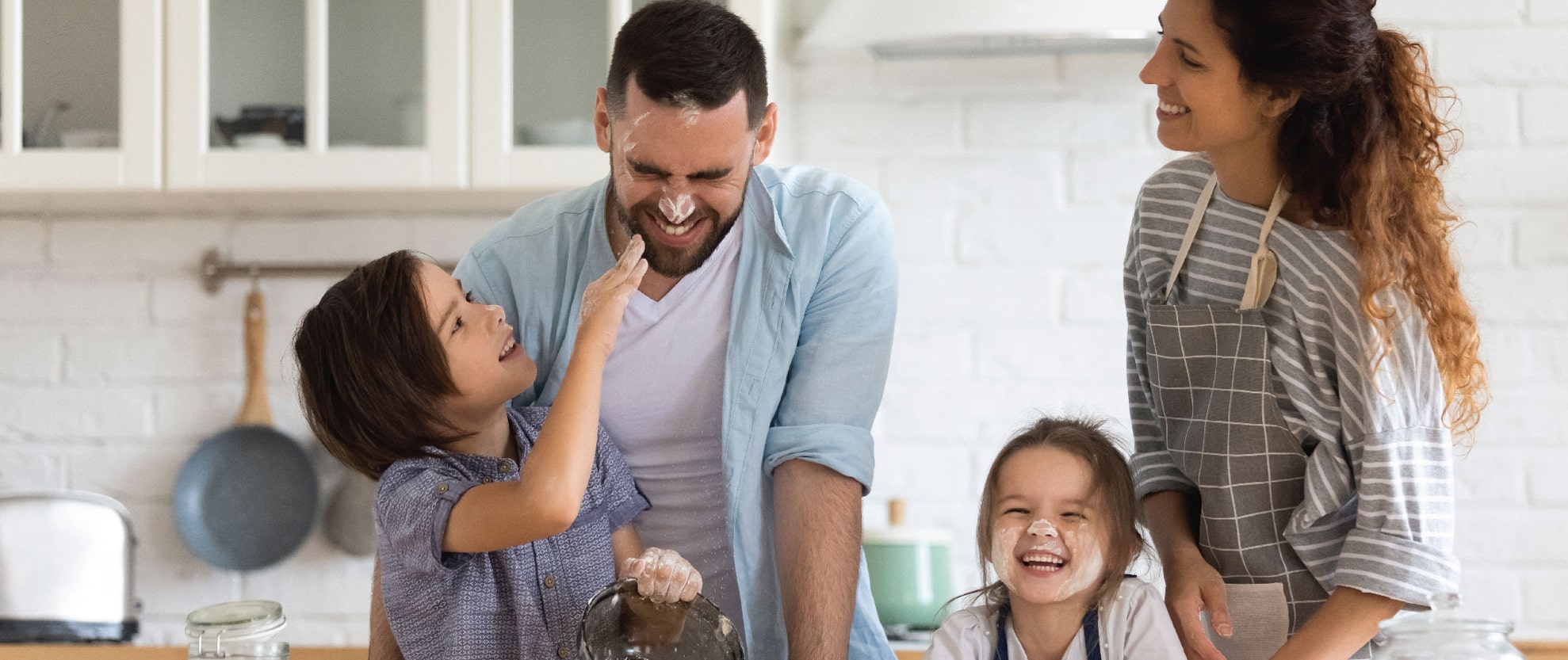 Family baking together in kitchen